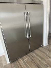 a stainless steel refrigerator in a kitchen