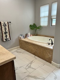 a bathroom with a tub and a sink